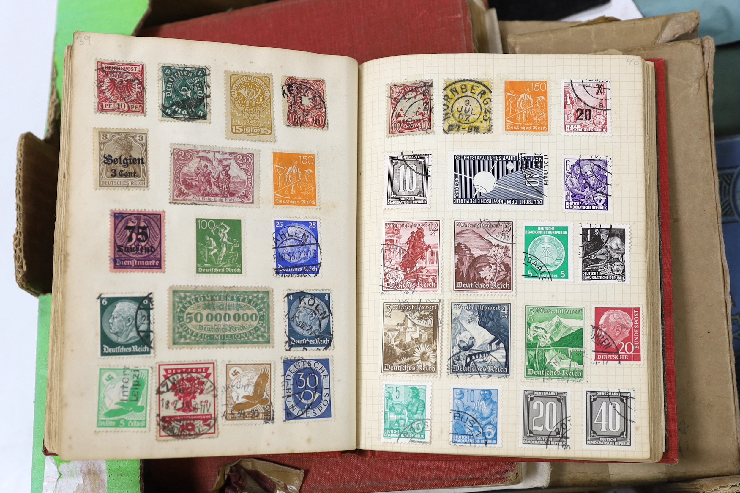A box of mixed stamp albums